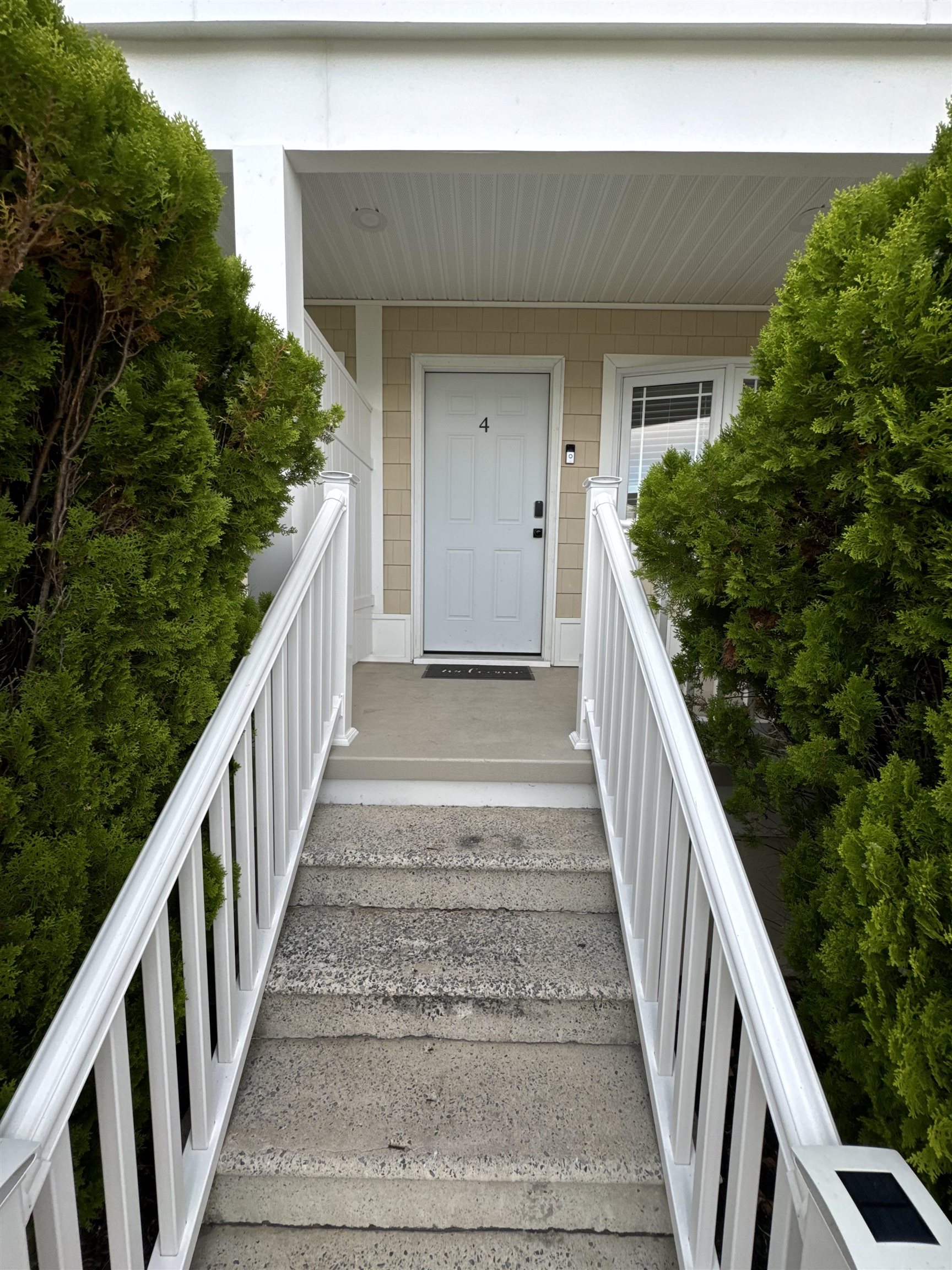 a view of balcony with wooden floor and fence