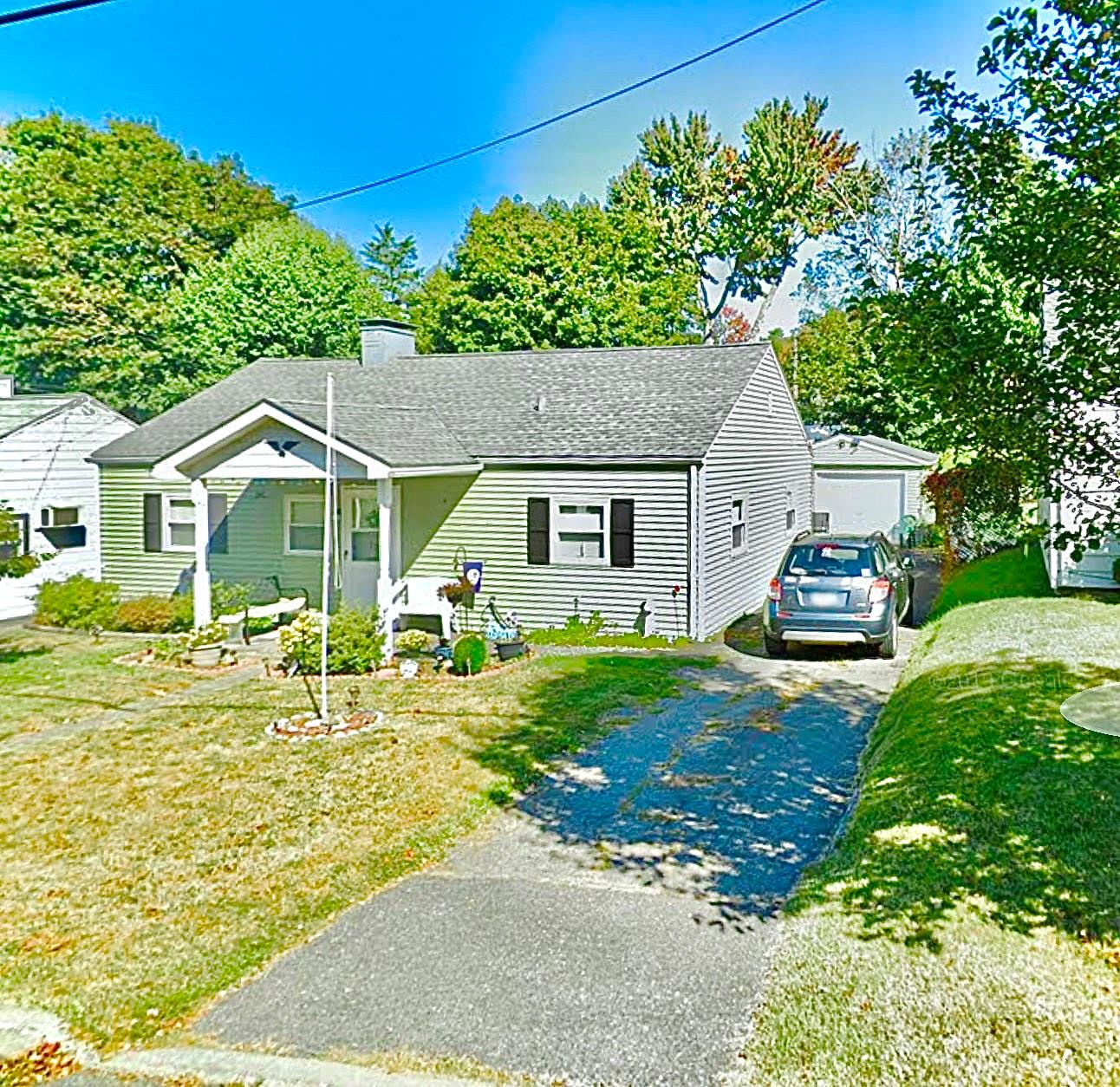 a house view with a garden space