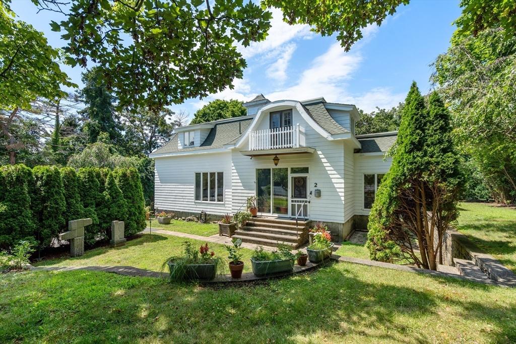 a aerial view of a house with a yard