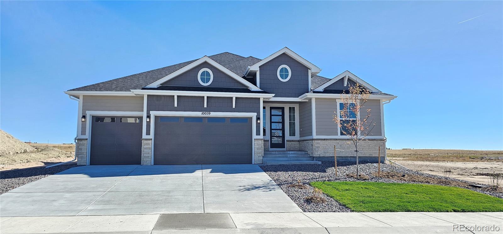 a front view of a house with a yard