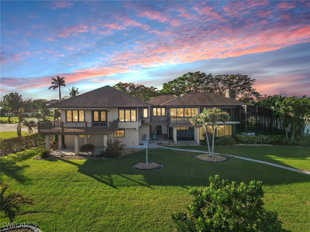 a view of a house with a big yard