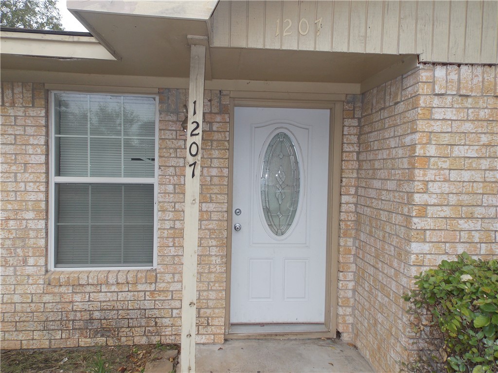 a front view of a house with entryway