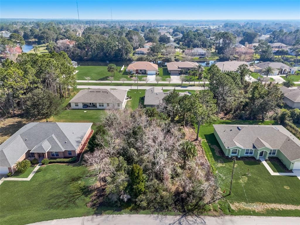 an aerial view of house with yard swimming pool and outdoor seating