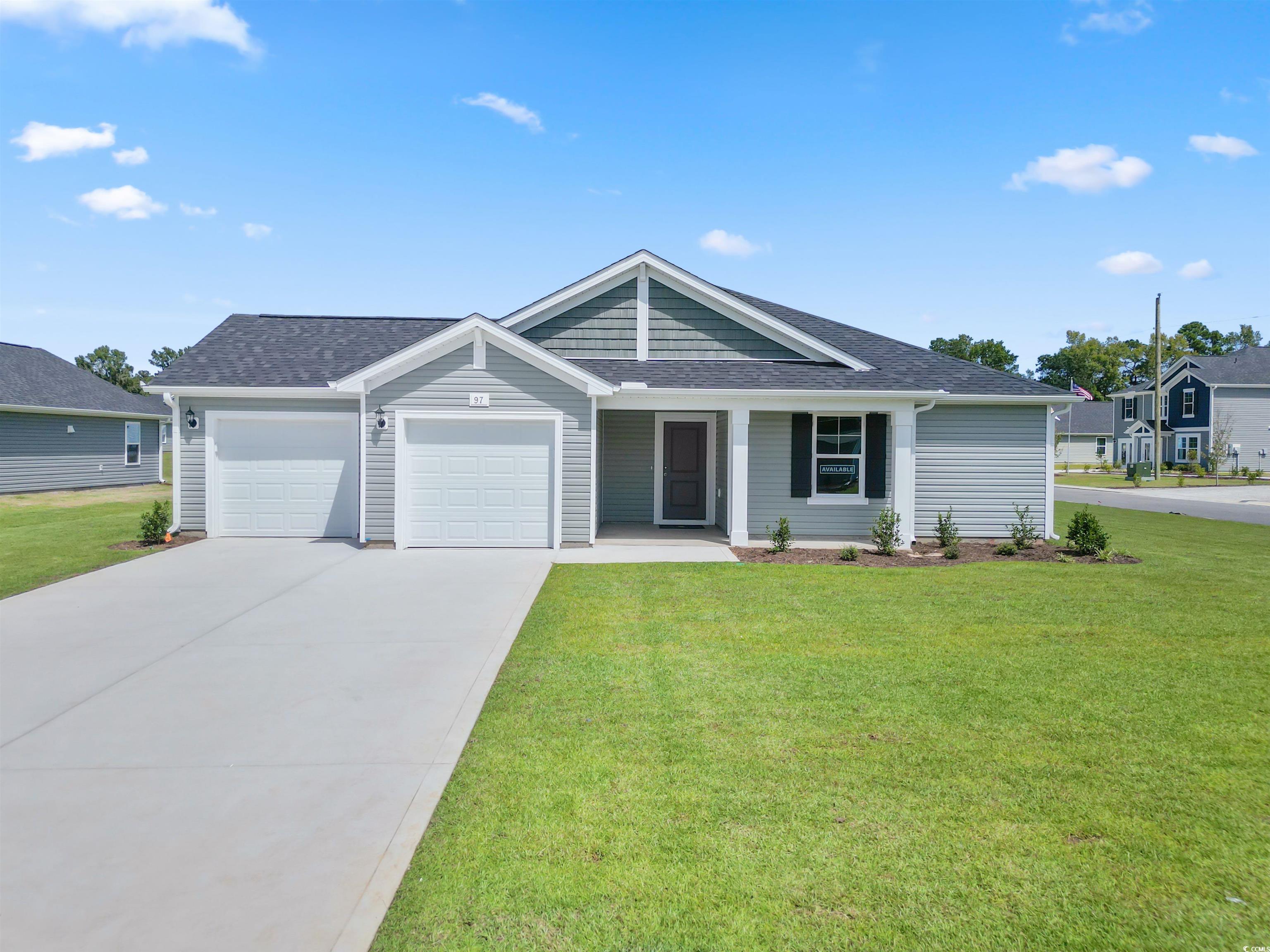 View of front facade featuring a front yard and a