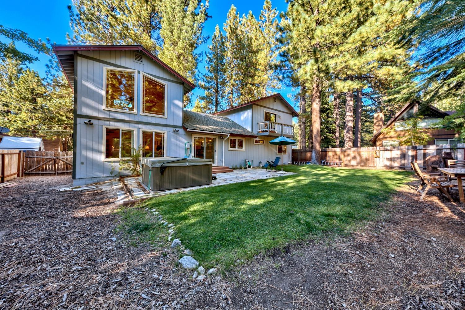 a front view of a house with yard and green space