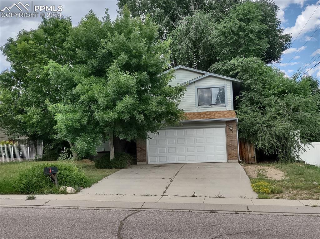 Front of home, mature landscaping