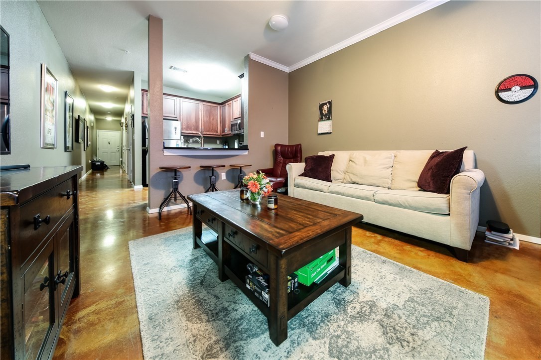 a living room with furniture and a table