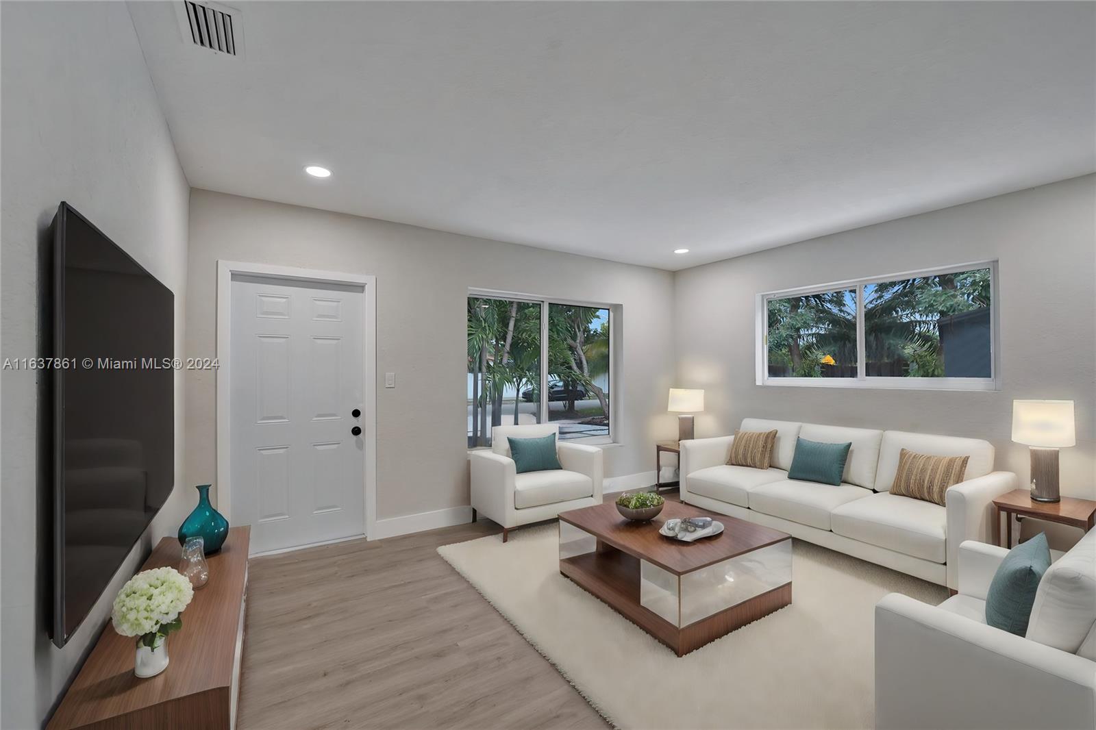 a living room with furniture and a window