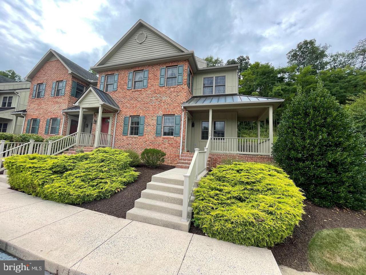 front view of a house with a garden