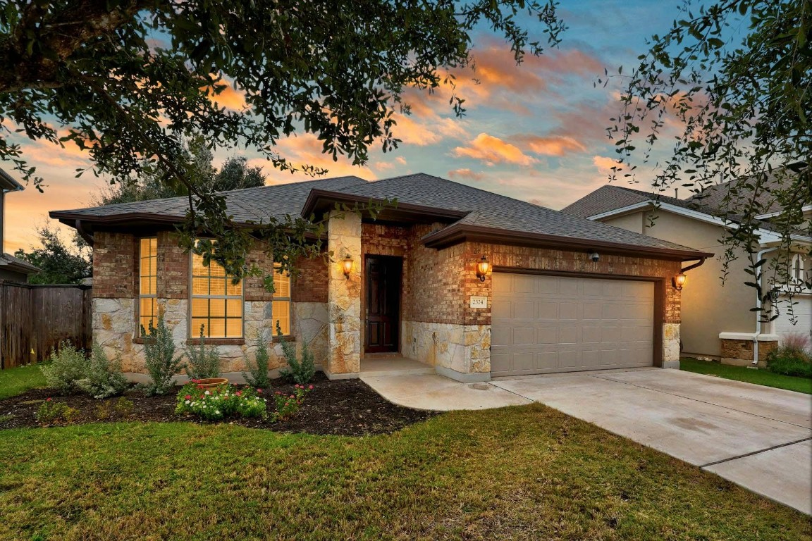 a front view of a house with garden