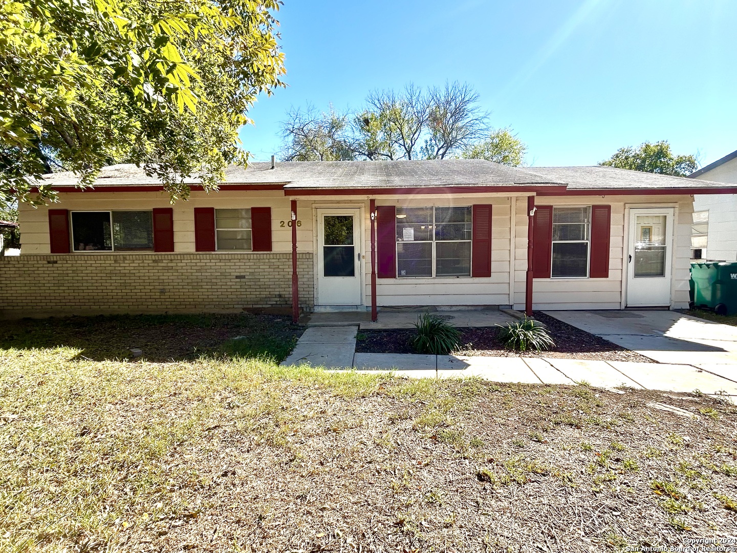 front view of a house with a yard