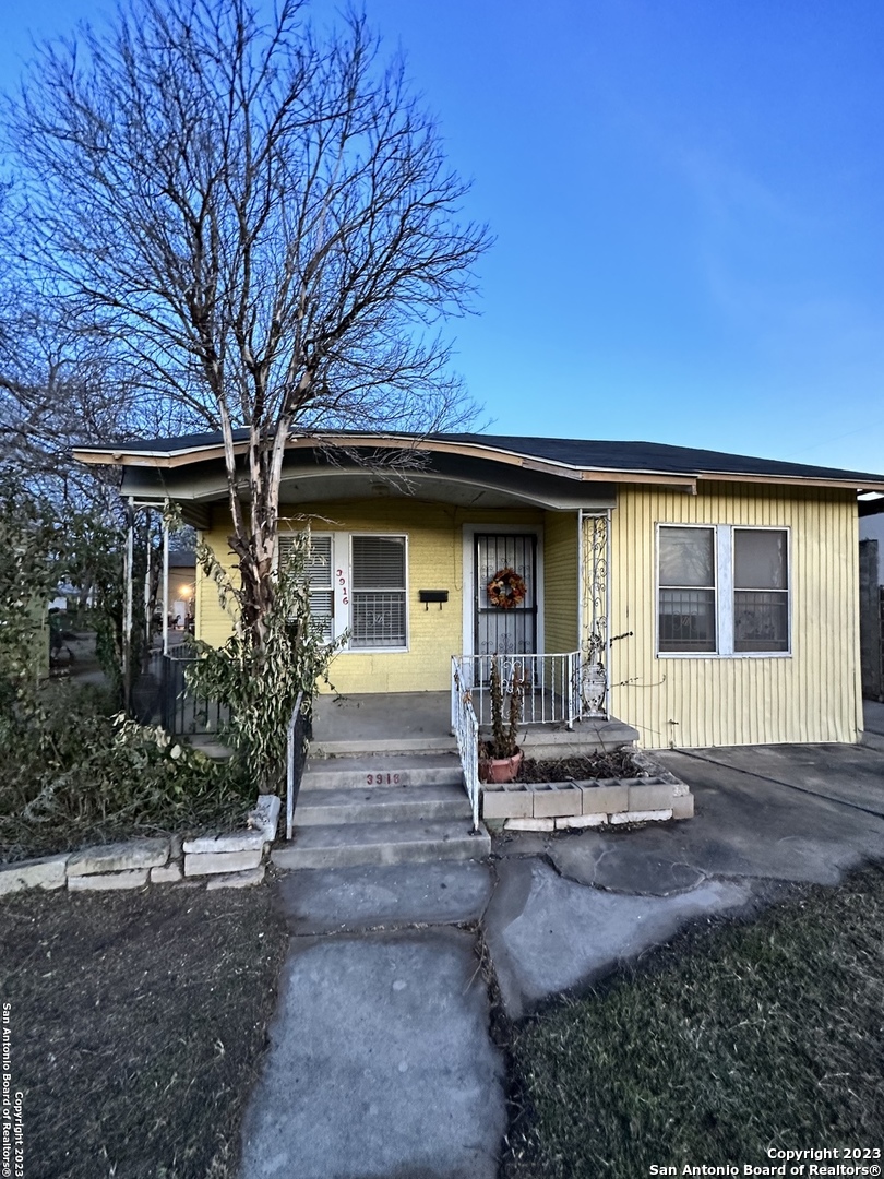 a front view of a house with yard