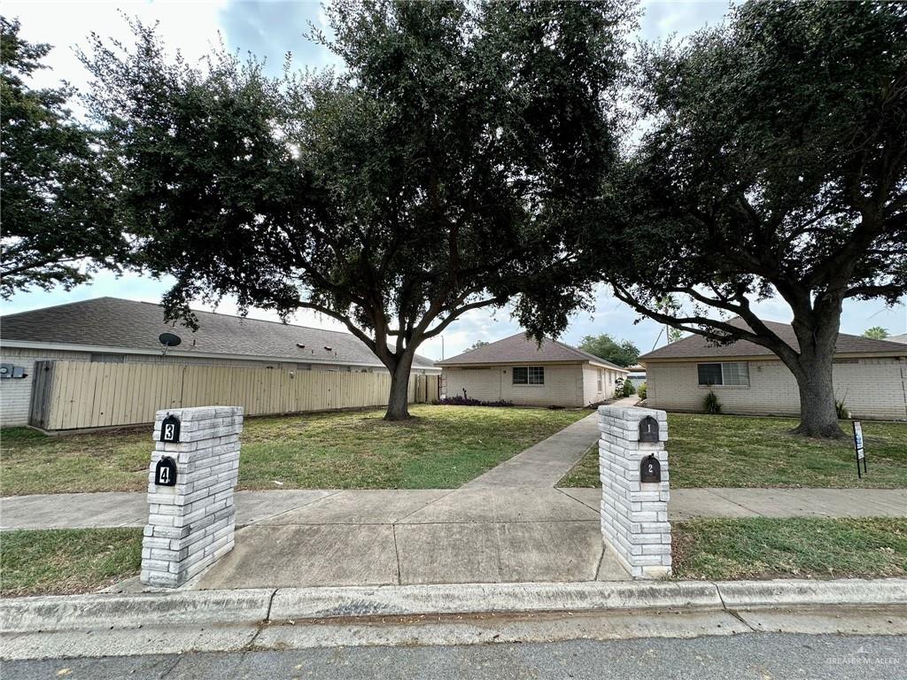 front view of a house with a tree