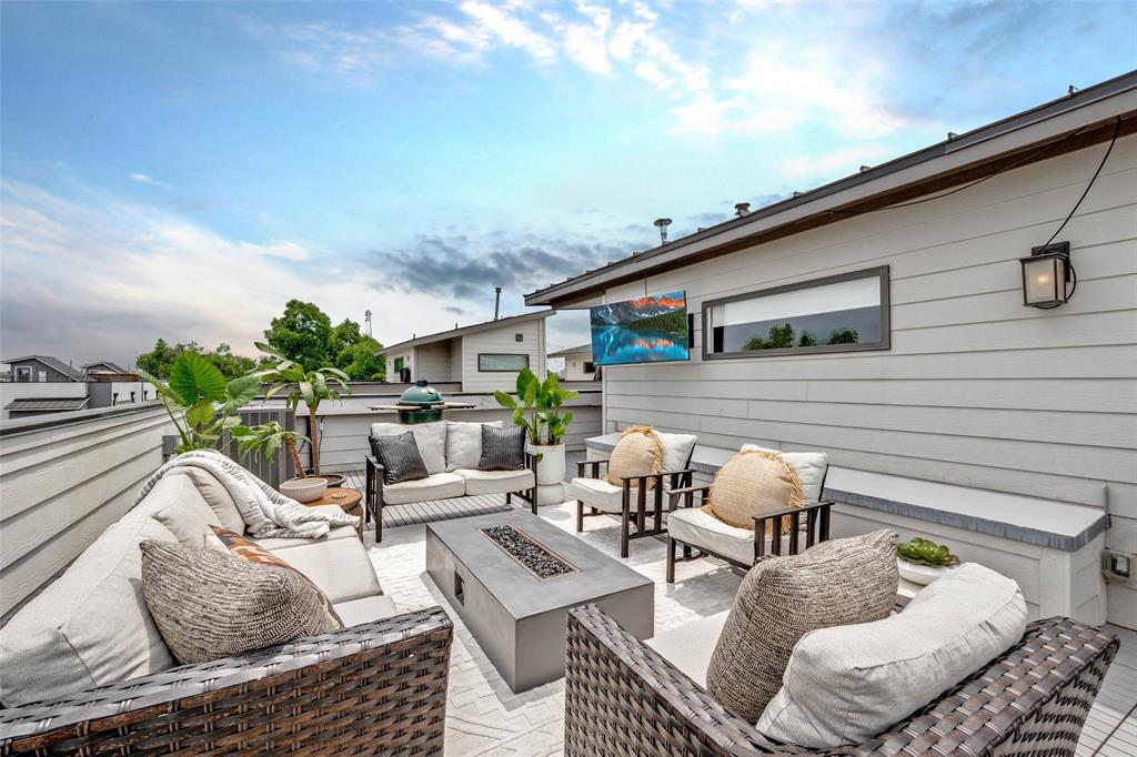 a outdoor living space with furniture and city view