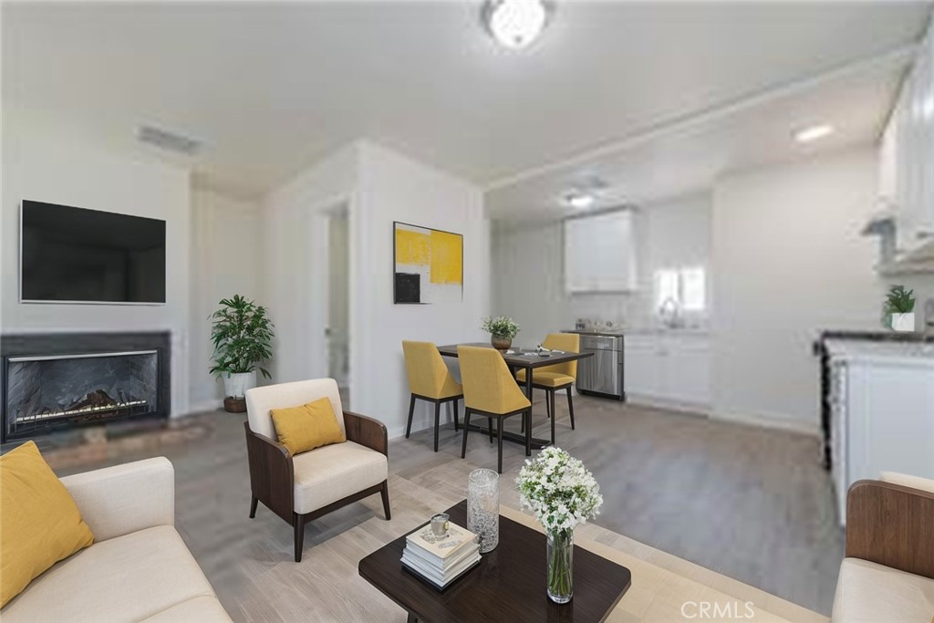 a living room with furniture fireplace and a flat screen tv