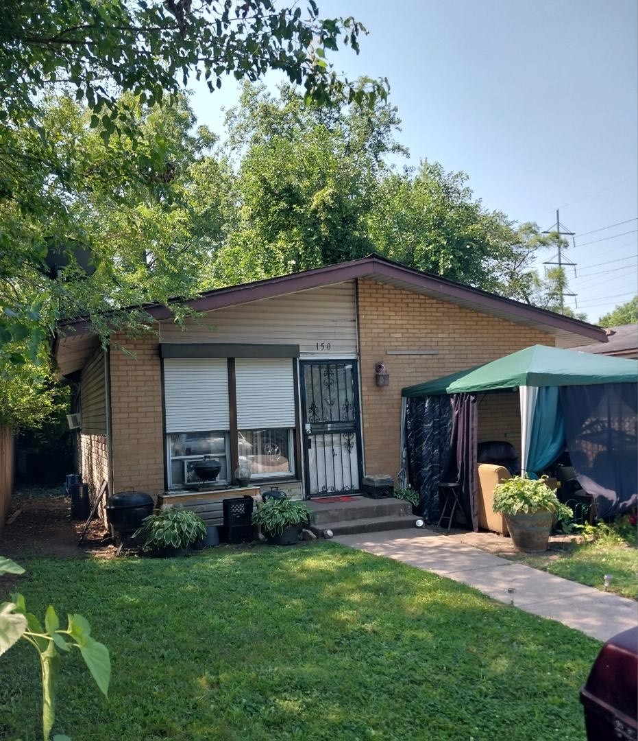 a house that has a tree in front of it