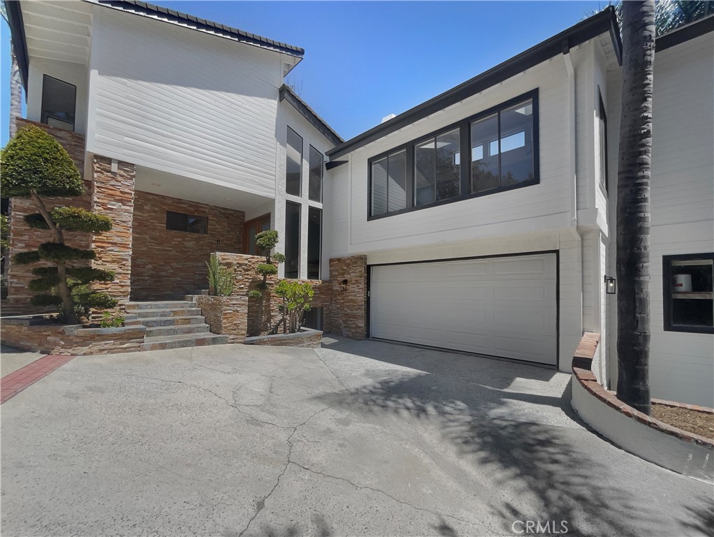 a view of a house with a garage