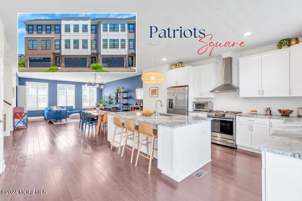 a kitchen with stainless steel appliances granite countertop a stove and cabinets