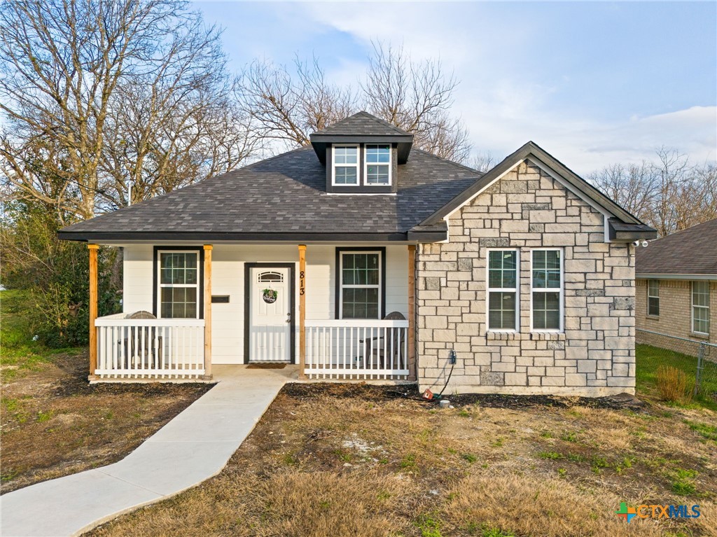 front view of a house with a yard