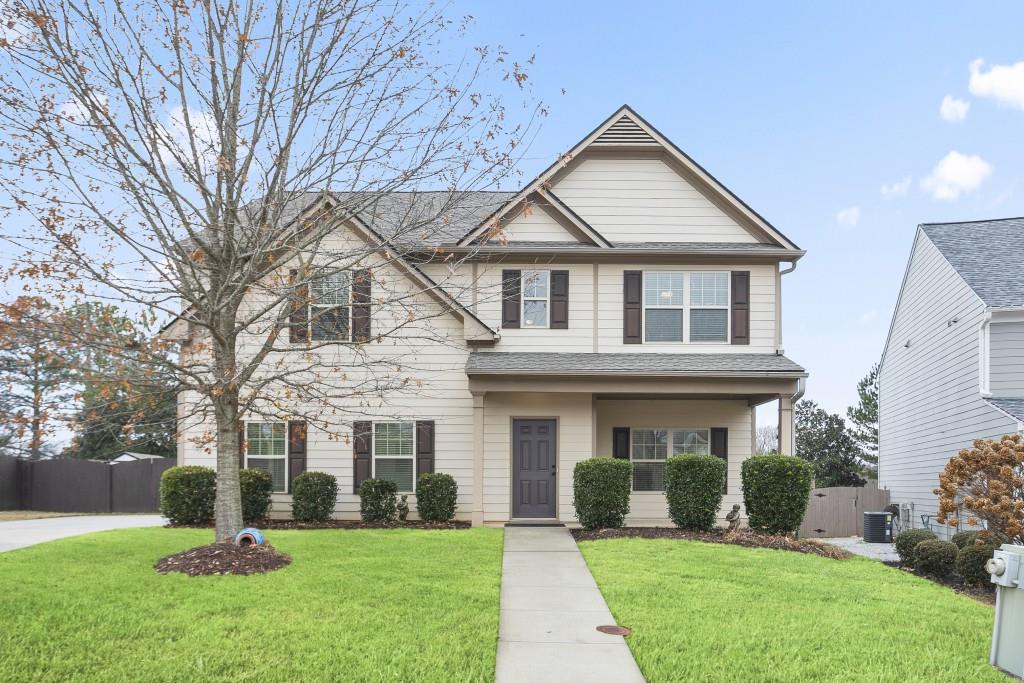 front view of a house with a yard