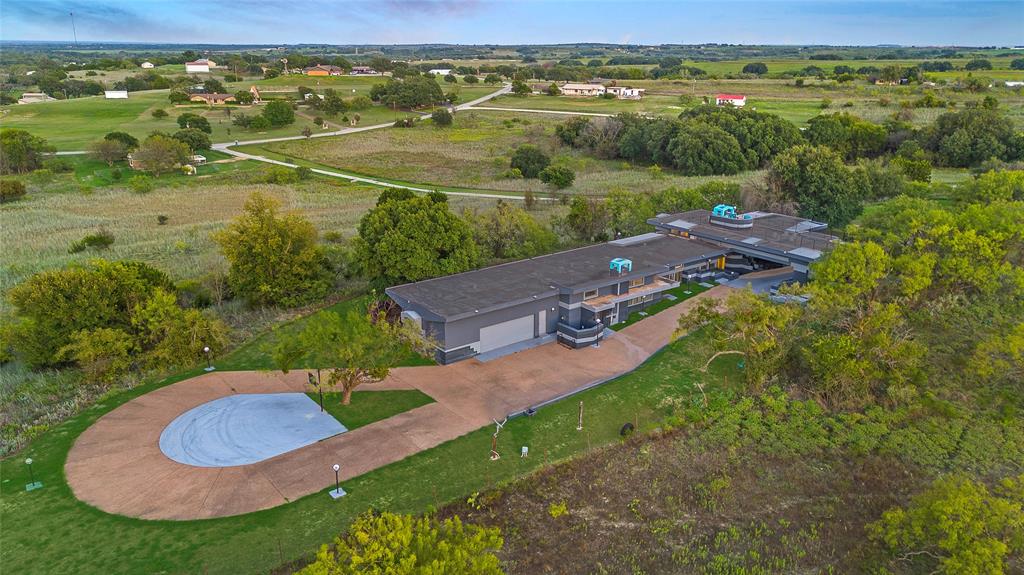 an aerial view of a house with a lake view