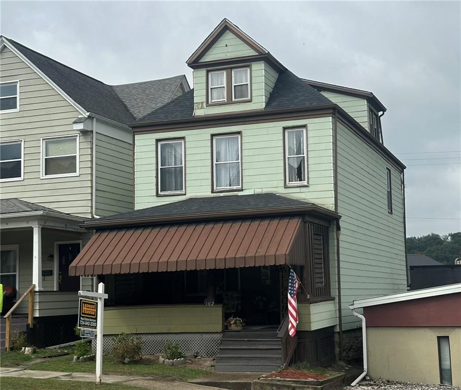 a front view of a house with garage