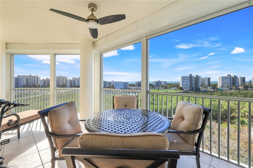 a view of a balcony with a table and chairs