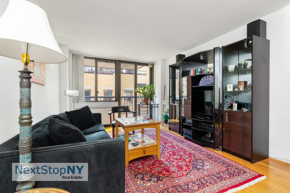 a living room with furniture and a rug