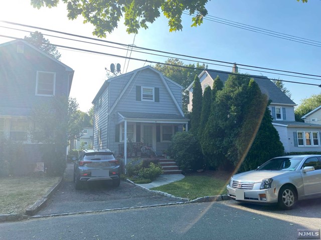 a car parked in front of a house