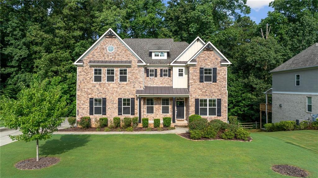 a front view of a house with a yard