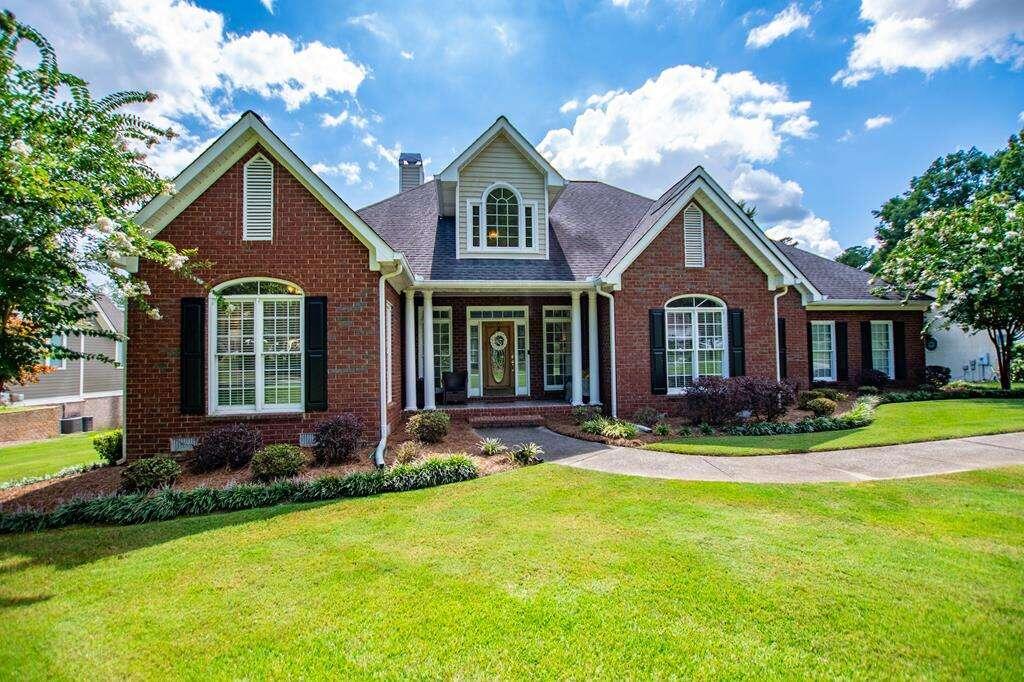 a front view of a house with a yard