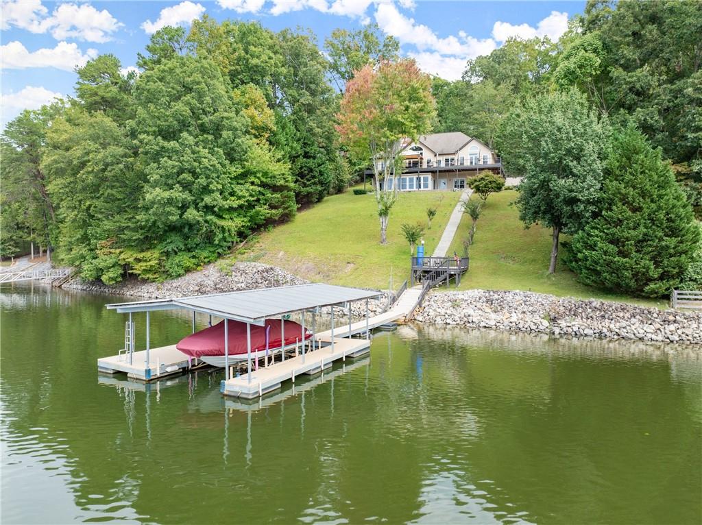 a view of a lake with a house in the background