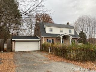 View of property with a garage