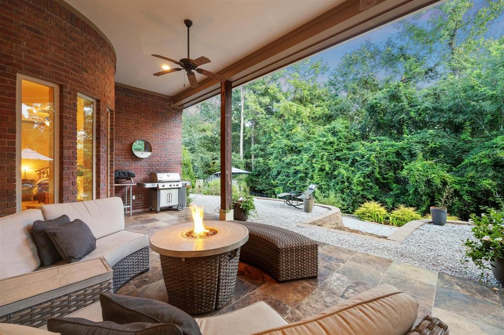 A gorgeous covered patio is the coveted space at this residence