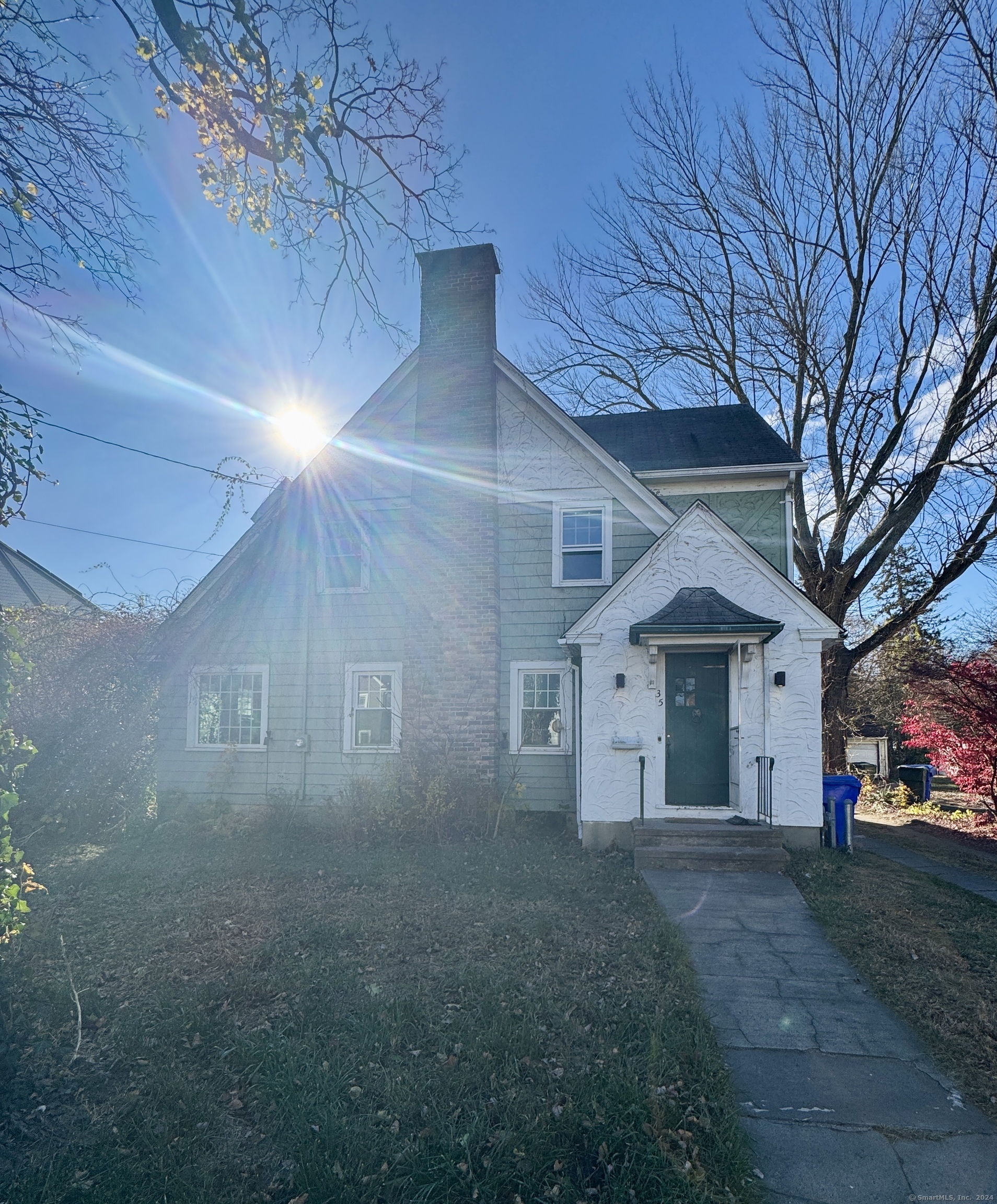 front view of a house with a street