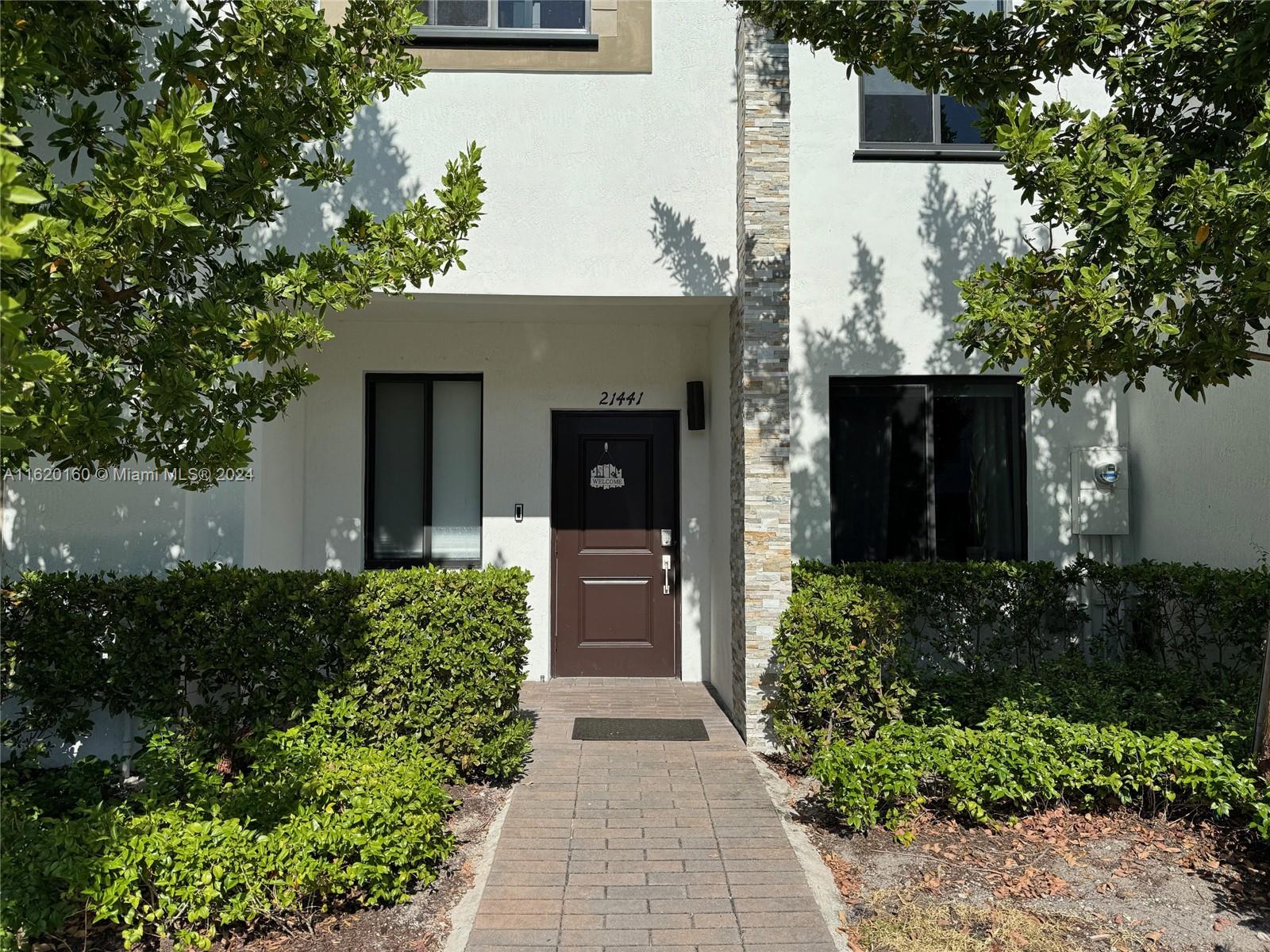 front view of a house with a yard