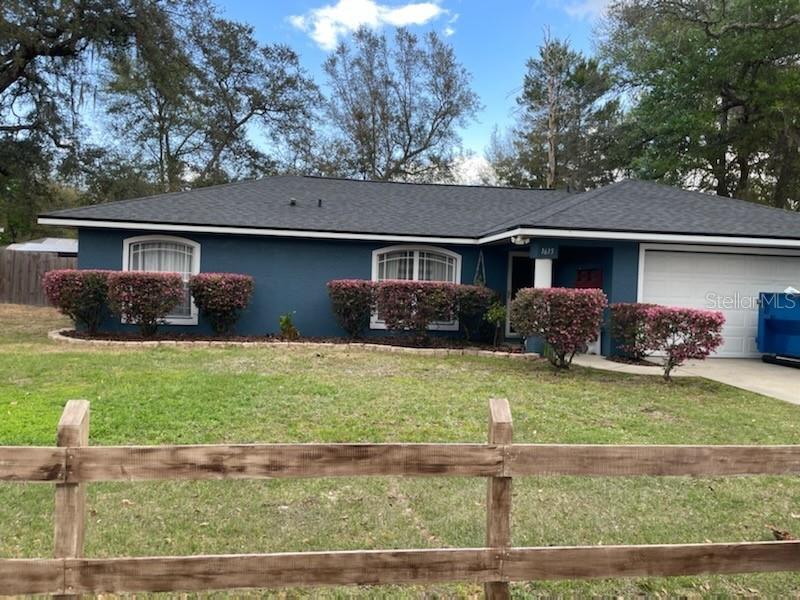 front view of a house with a yard