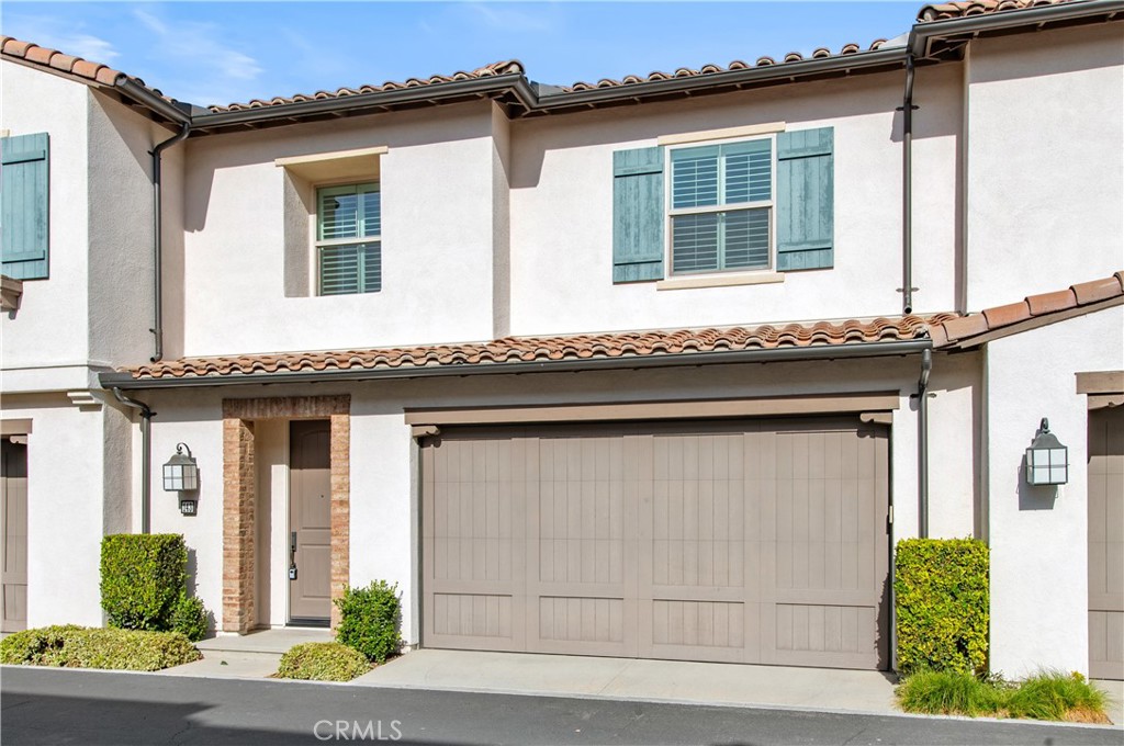 a front view of a house with a garage