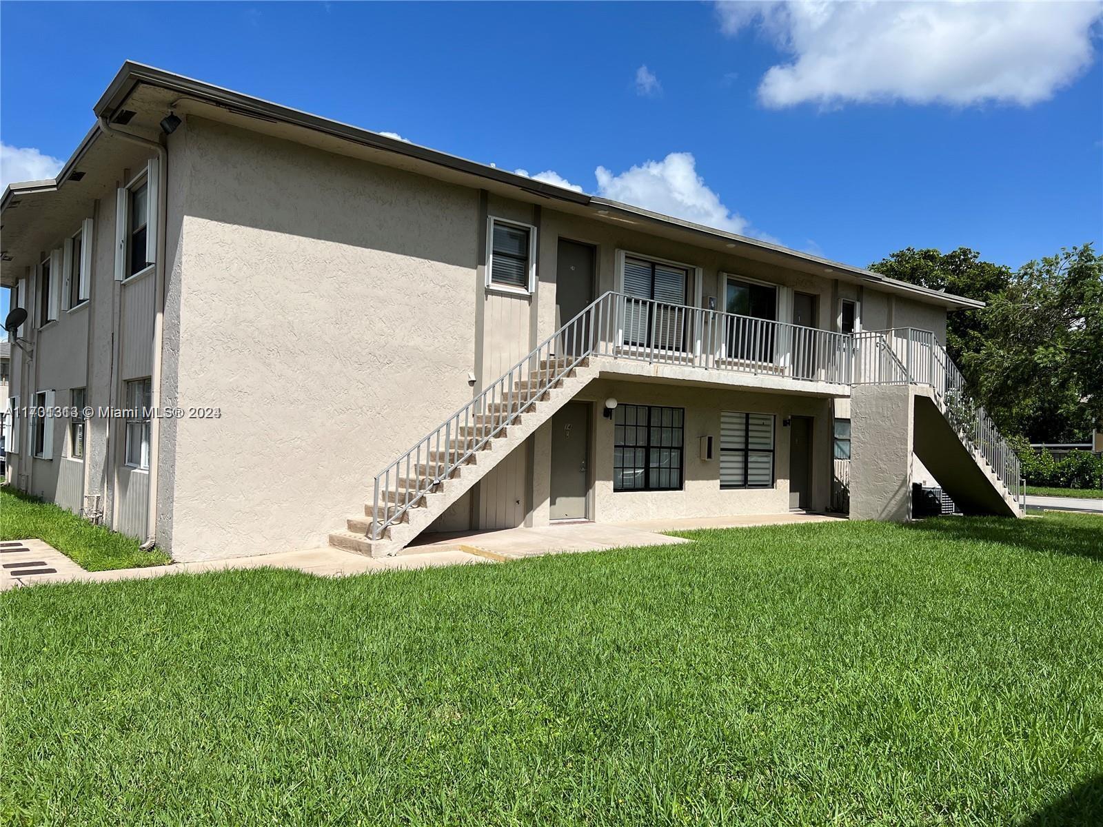 a view of front of house with a yard