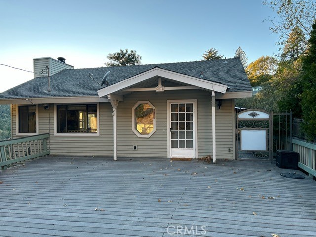 a view of a house with wooden fence