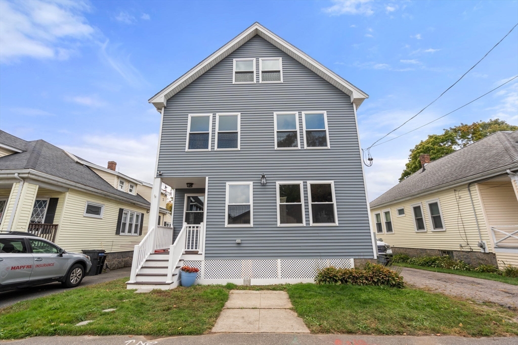 a front view of a house with a yard