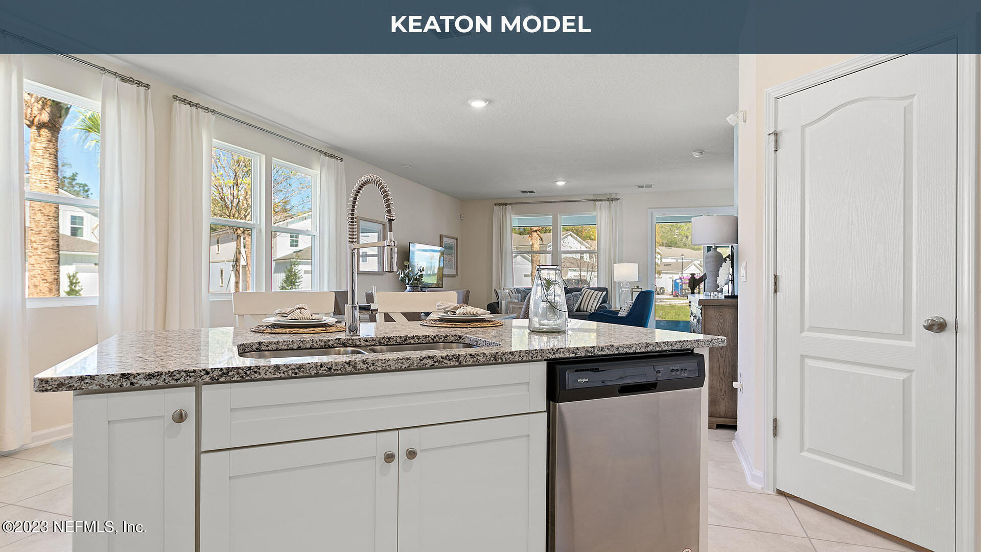 a kitchen with kitchen island granite countertop a sink and cabinets