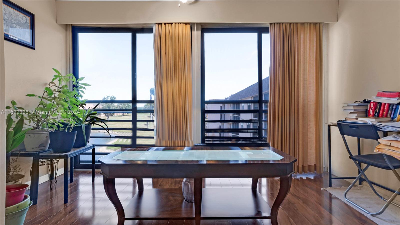 a view of a balcony with chairs