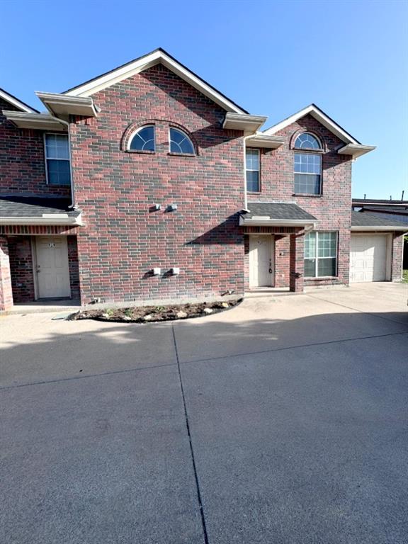 a front view of a house with a garage