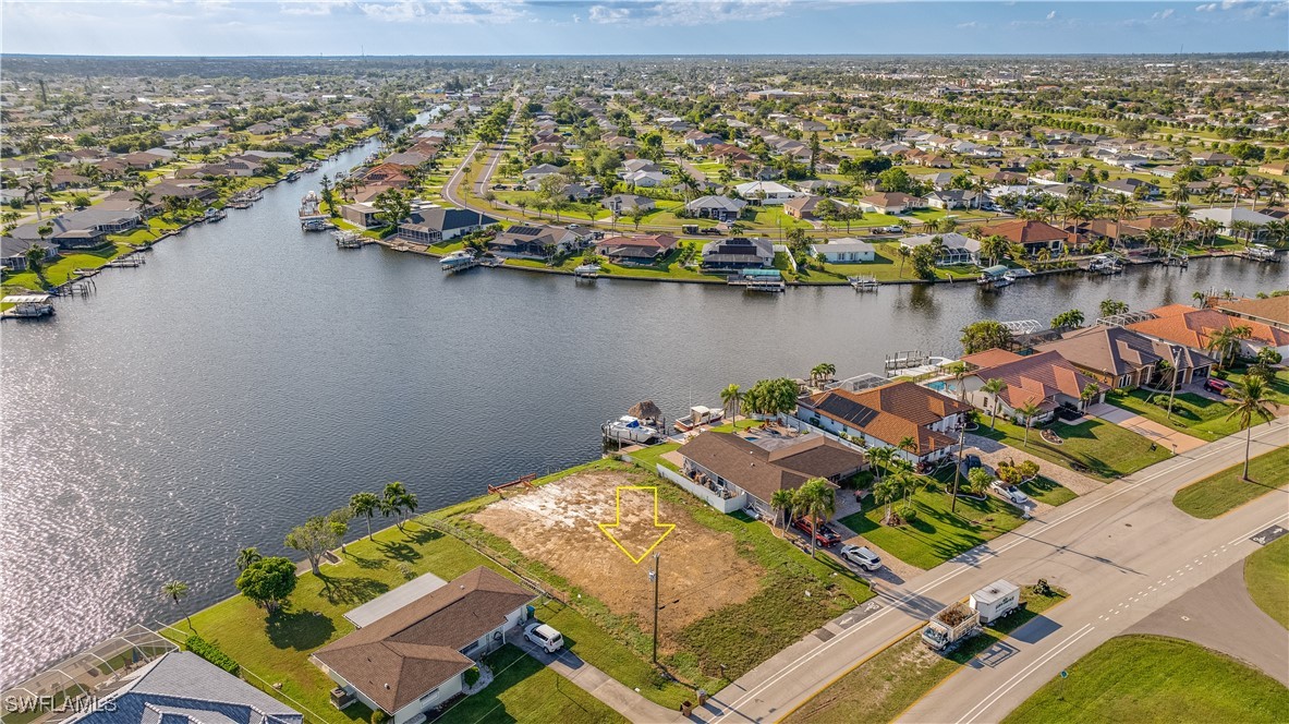 an aerial view of a house with a lake view