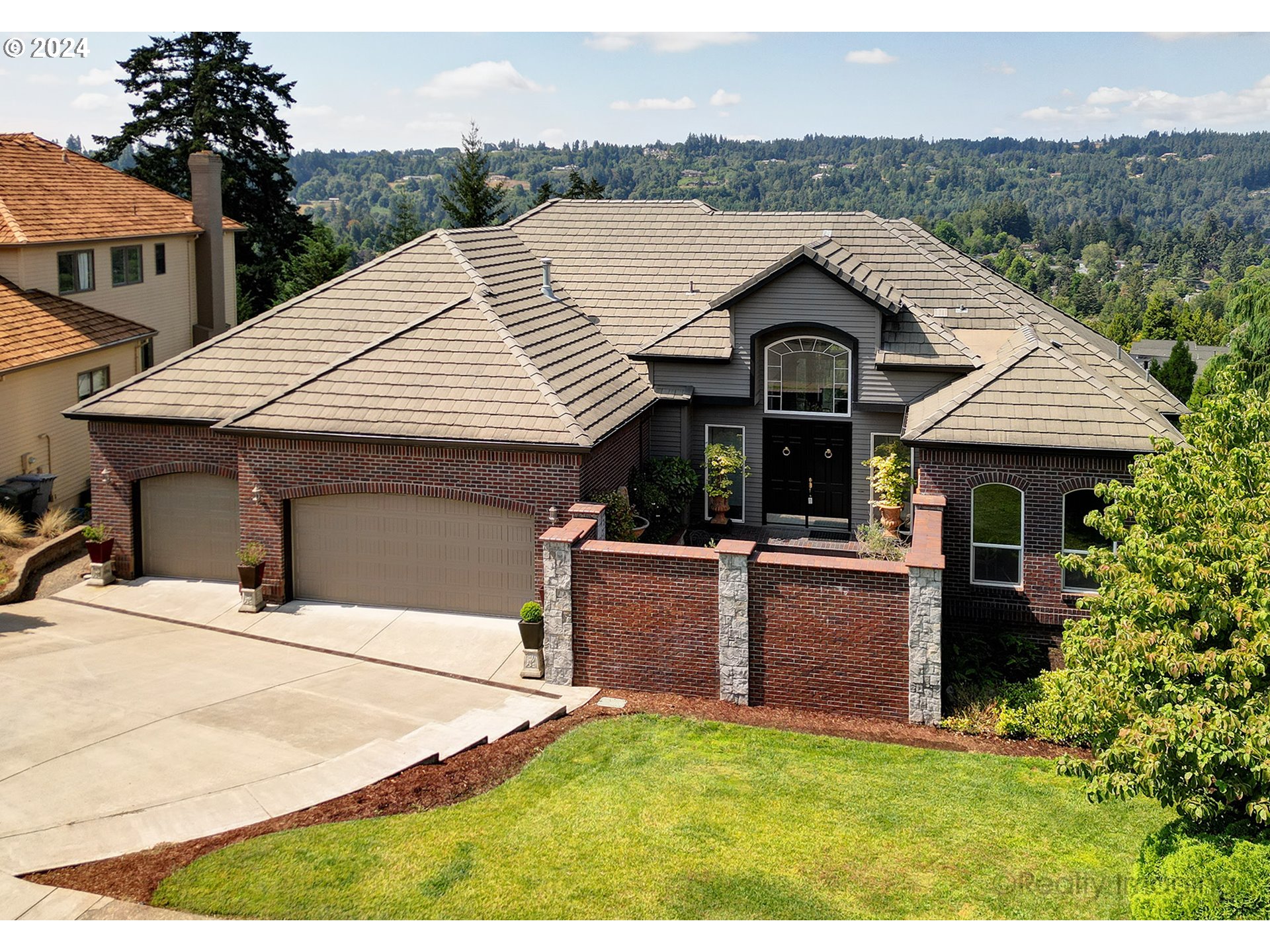 a view of house with yard and entertaining space