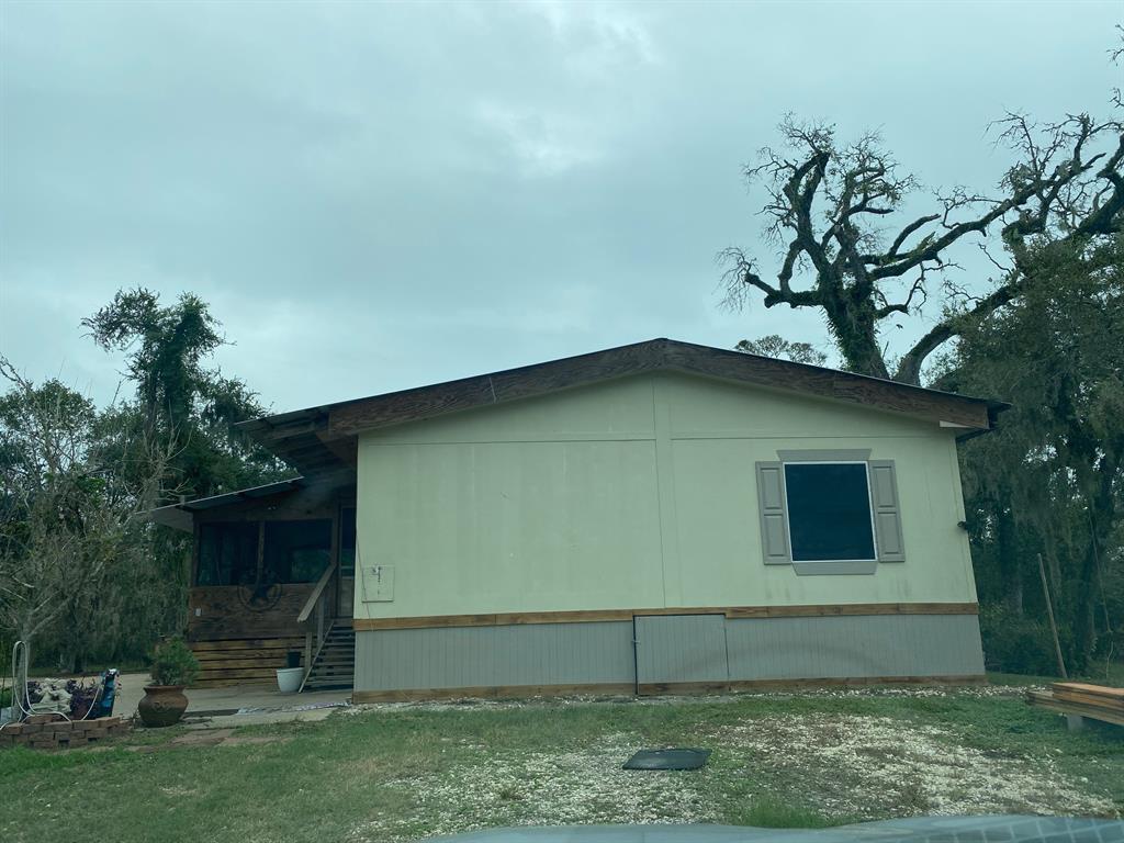 a house with a tree in front of it