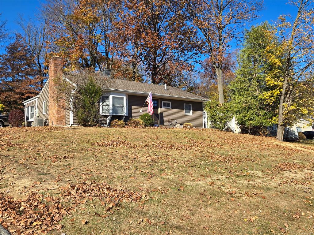 Single story home featuring a front yard