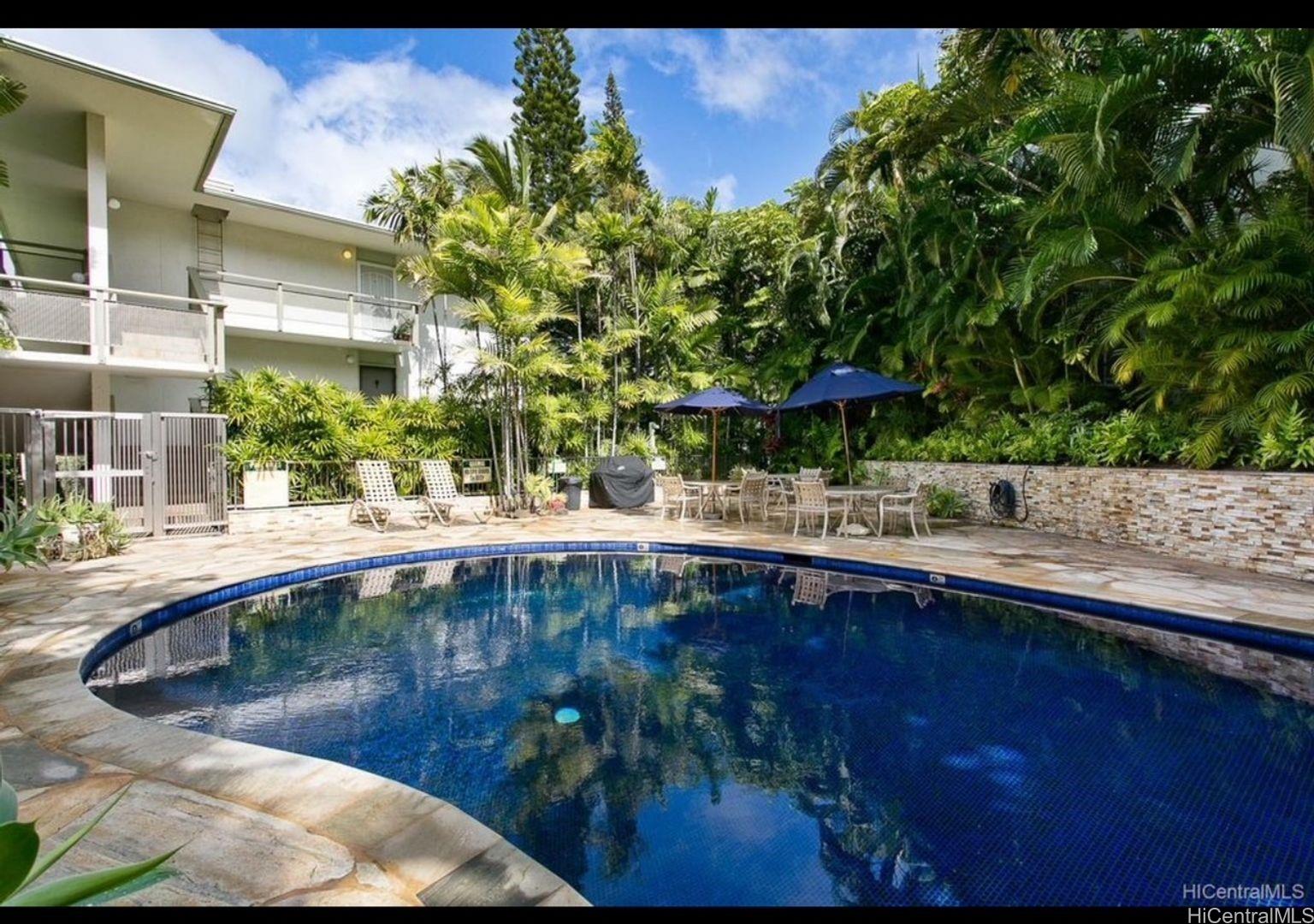 a view of a swimming pool with a patio