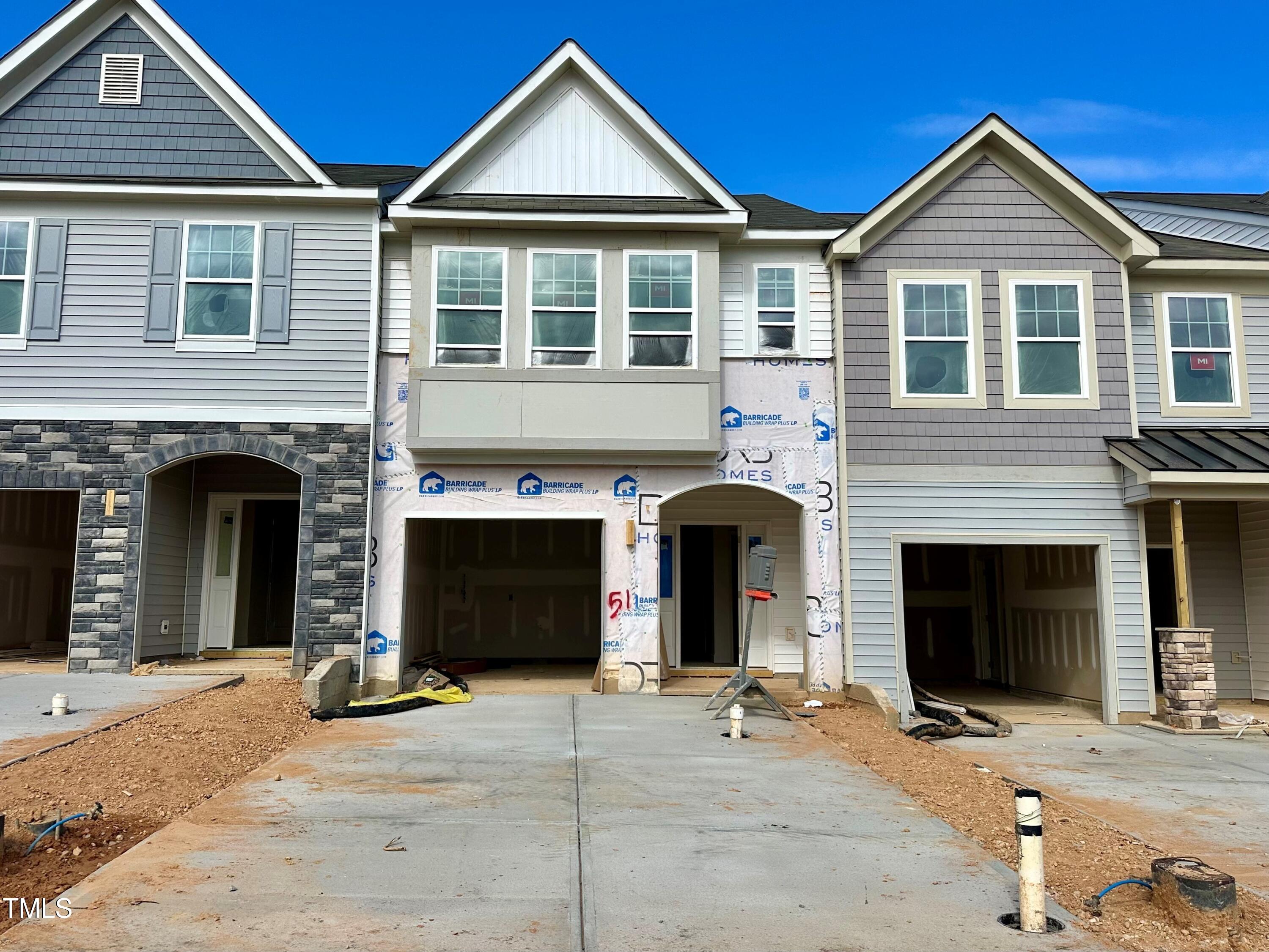 a front view of a house with yard